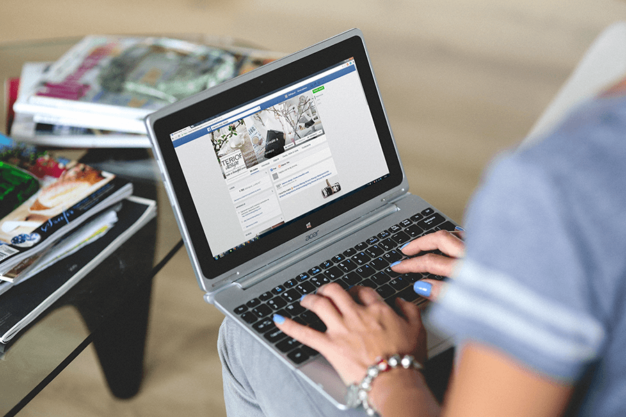 Person on their laptop looking at Facebook