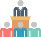 Person at podium talking to other people